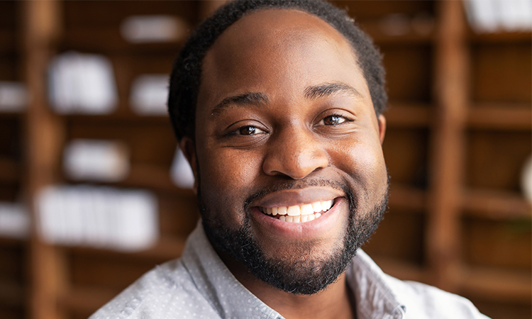 Male employee smiling at the camera