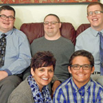 family photo of suzanne with her son and 3 boys that she mentors