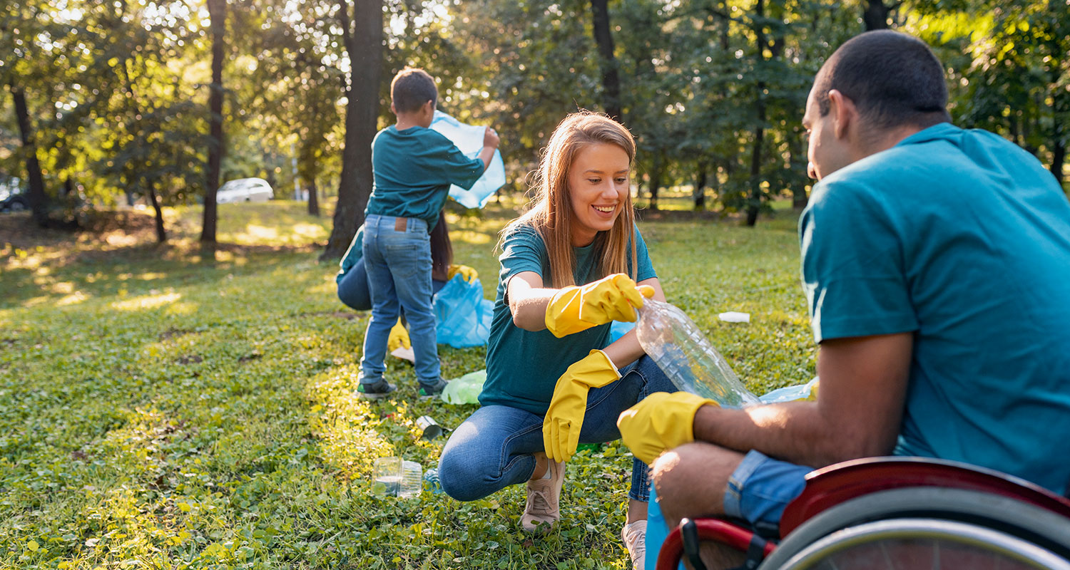 Volunteers helping clean up trash at a park