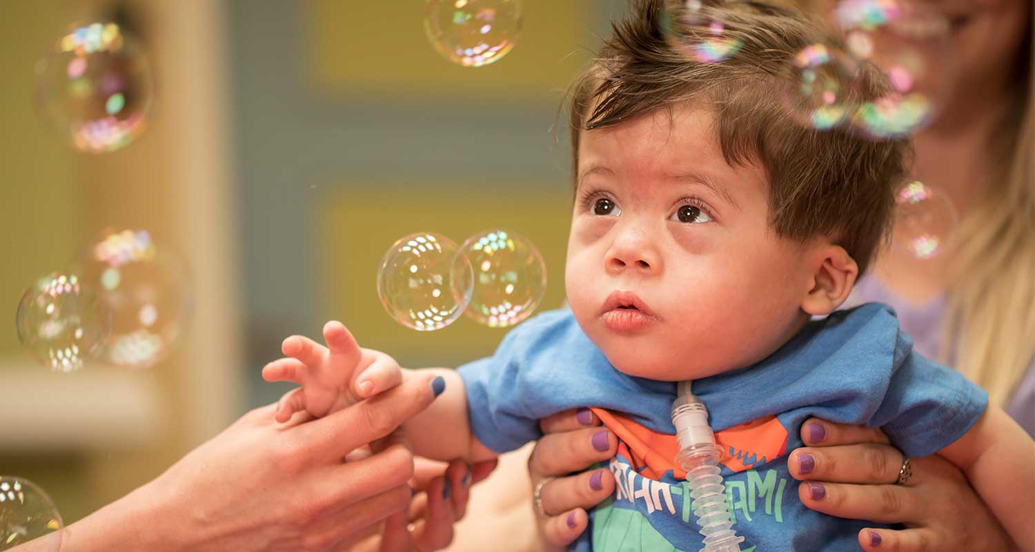 Baby hospital patient in a room with bubbles